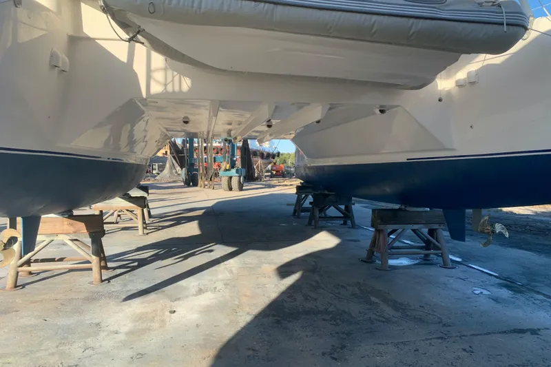 Slide: The Image of Catamaran Dolphin 43, 2002 model, on dry dock for maintenance. - 19