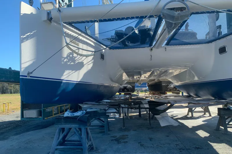 Slide: The Image of Catamaran Dolphin 43, 2002 model, under maintenance on dry dock. - 22