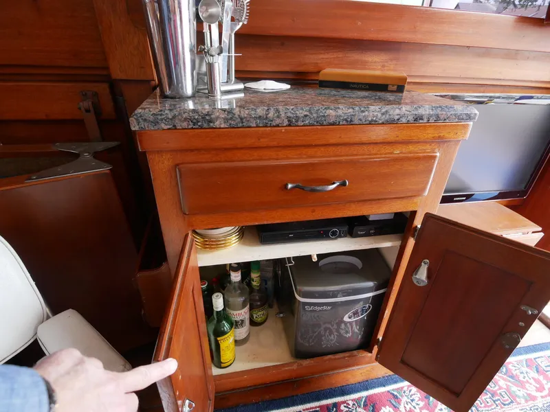Slide: The Image of Wooden cabinet with granite top on a 1964 Egg Harbor 37 Convertible Sedan boat. - 37