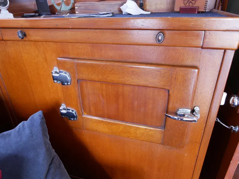 Slide: The Image of Vintage wooden cabinet on a 1964 Egg Harbor 37 Convertible Sedan boat. - 13