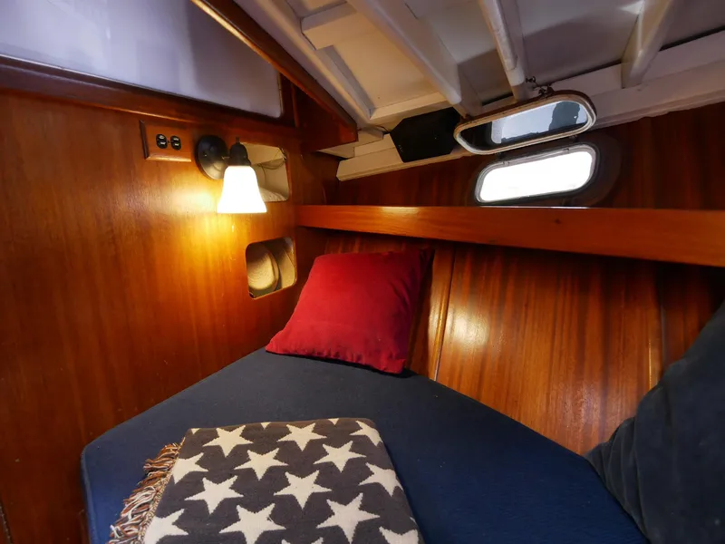 Slide: The Image of Cozy cabin interior of 1964 Egg Harbor 37 Convertible Sedan with wooden paneling. - 20