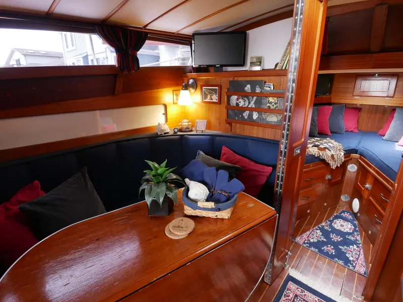 Slide: The Image of Interior of 1964 Egg Harbor 37 Convertible Sedan with cozy seating and wooden finishes. - 22