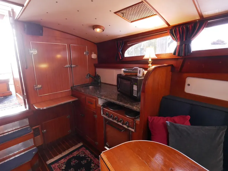 Slide: The Image of Interior of 1964 Egg Harbor 37 Convertible Sedan with kitchen and dining area. - 28