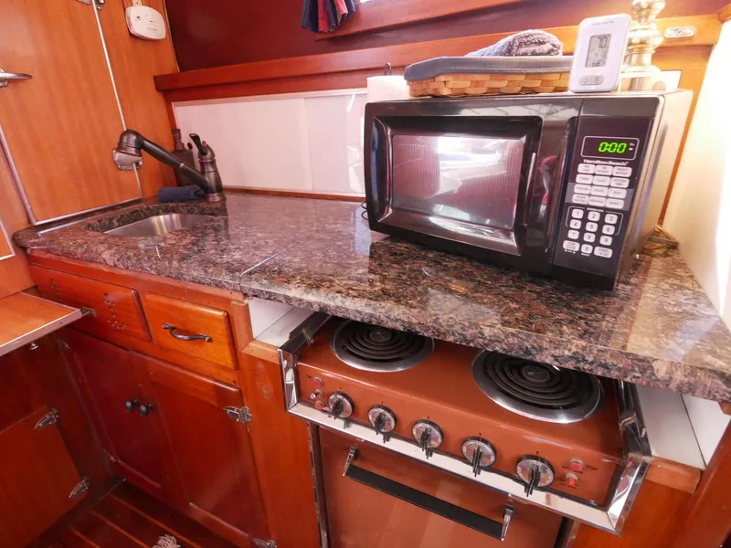 Slide: The Image of 1964 Egg Harbor 37 Convertible Sedan kitchen with microwave and stove - 30