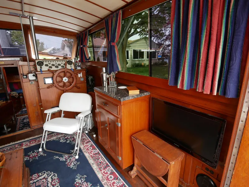 Slide: The Image of Interior of 1964 Egg Harbor 37 Convertible Sedan with wooden cabinetry and nautical decor. - 38