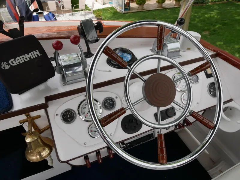 Slide: The Image of 1964 Egg Harbor 37 Convertible Sedan boat helm with Garmin navigation system. - 40