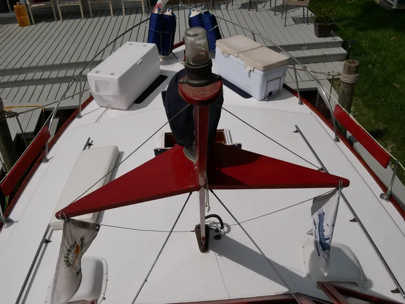 Slide: The Image of 1964 Egg Harbor 37 Convertible Sedan boat deck with coolers and flags. - 41