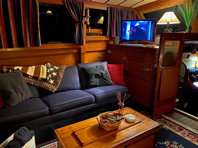 Slide: The Image of Interior of 1964 Egg Harbor 37 Convertible Sedan with cozy seating and TV. - 49