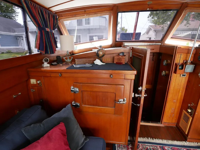 Slide: The Image of Interior of 1964 Egg Harbor 37 Convertible Sedan with wooden cabinetry and nautical decor. - 9