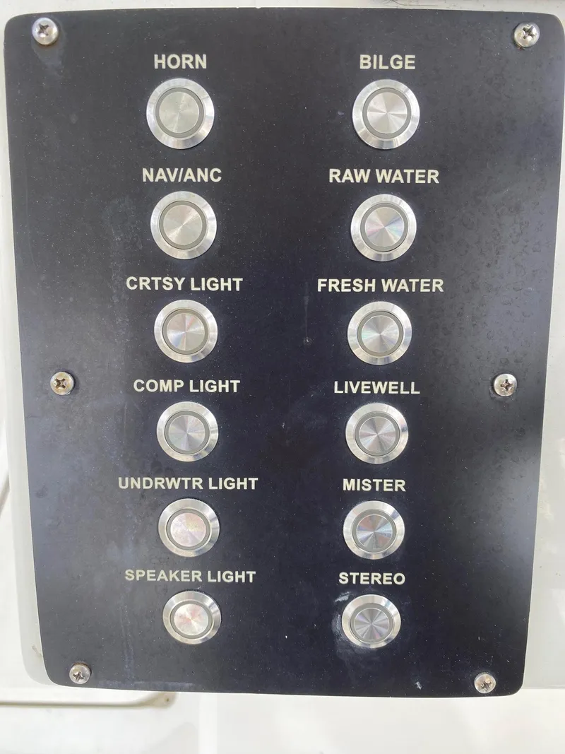 Slide: The Image of Control panel of a 2017 Century 24 Resorter boat with various switches. - 11