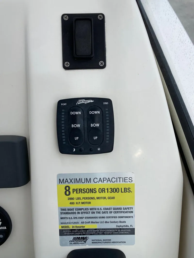 Slide: The Image of Control panel and capacity label on a 2017 Century 24 Resorter boat. - 12