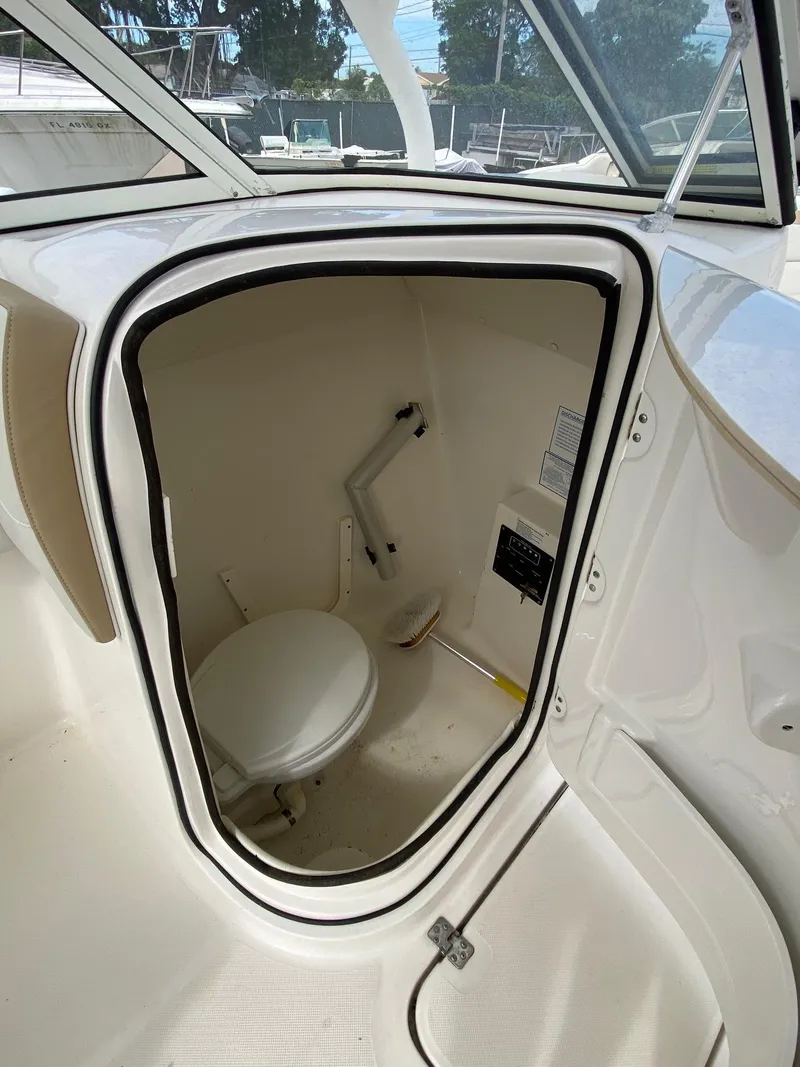 Slide: The Image of 2017 Century 24 Resorter boat interior with compact marine toilet. - 18