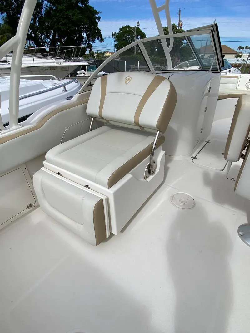 Slide: The Image of Century 24 Resorter 2017 boat interior with white and beige seating. - 23