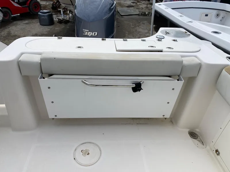 Slide: The Image of 2017 Century 24 Resorter boat interior with storage compartment and Yamaha 300 outboard motor. - 24