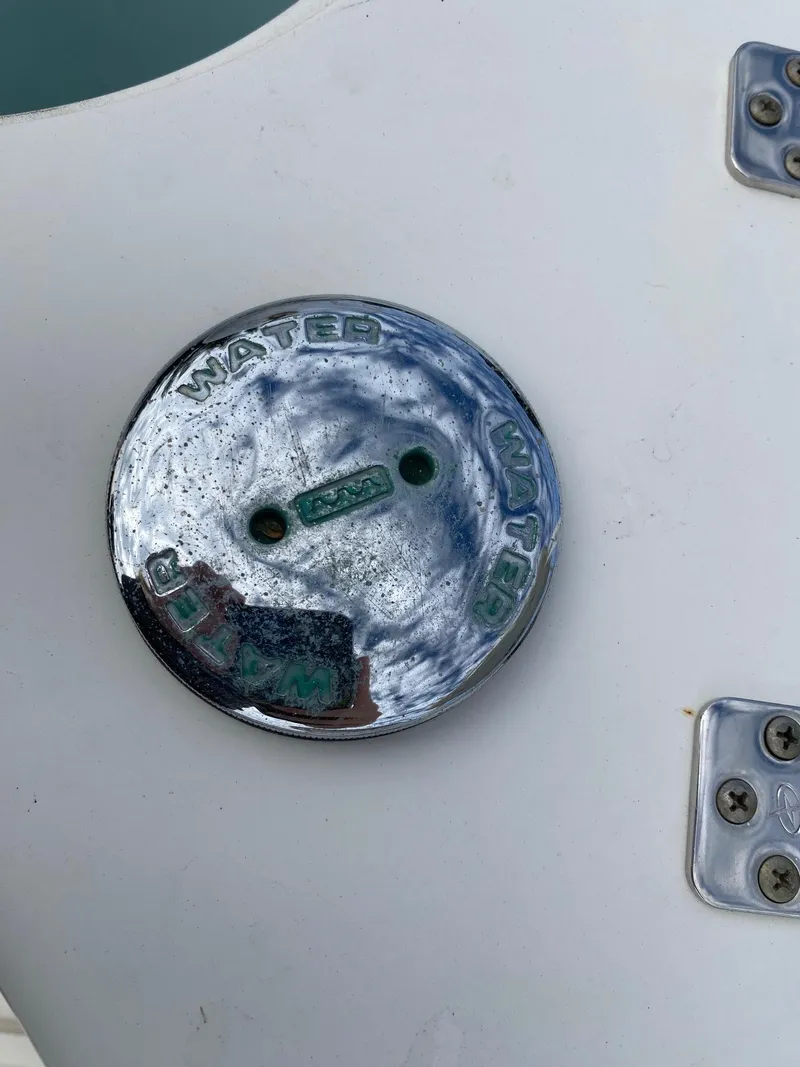 Slide: The Image of Century 24 Resorter 2017 water inlet on white boat surface - 30