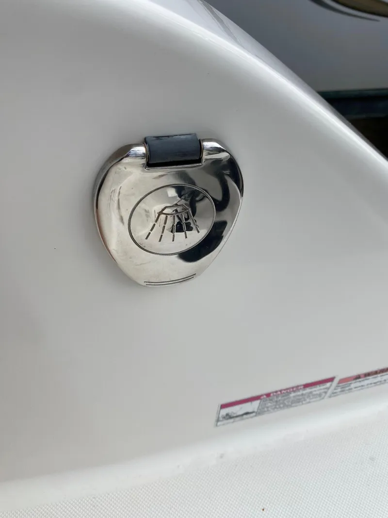 Slide: The Image of Close-up of a 2017 Century 24 Resorter boat's chrome fuel cap. - 31