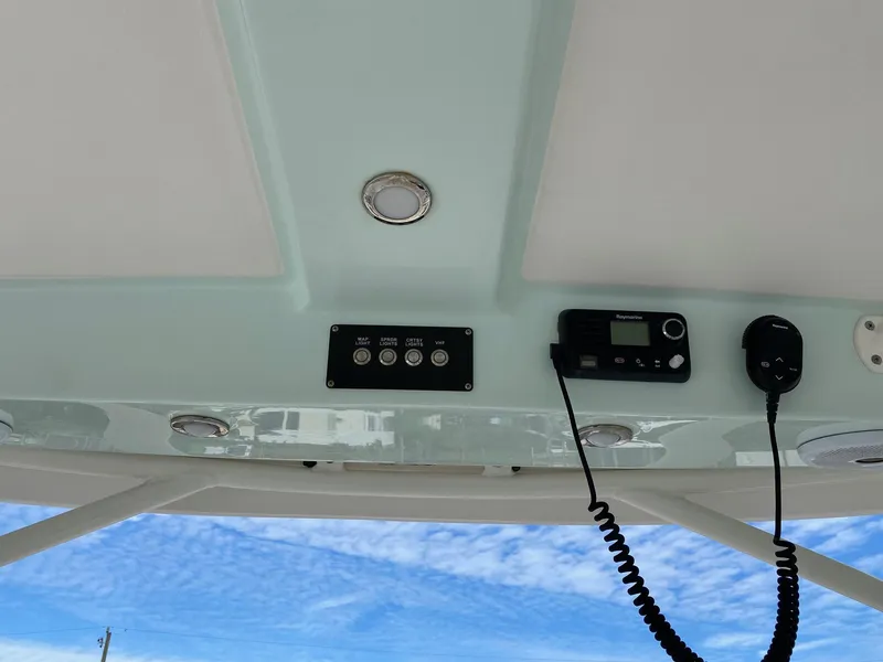 Slide: The Image of Century 24 Resorter 2017 boat console with controls and radio. - 35