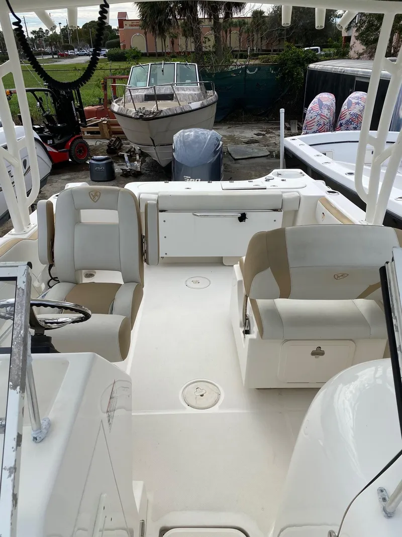 Slide: The Image of 2017 Century 24 Resorter boat interior with seating and steering wheel. - 6