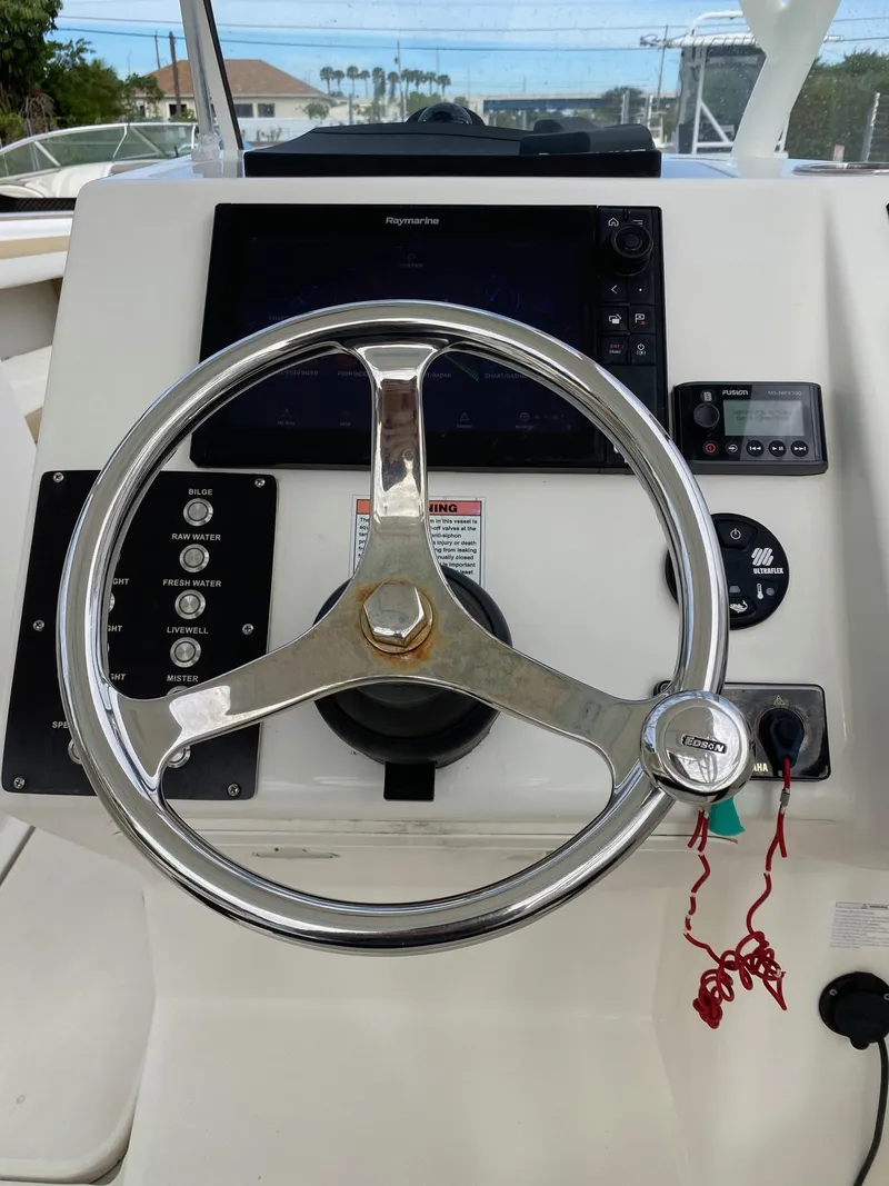 Slide: The Image of Steering wheel and dashboard of a 2017 Century 24 Resorter boat. - 8