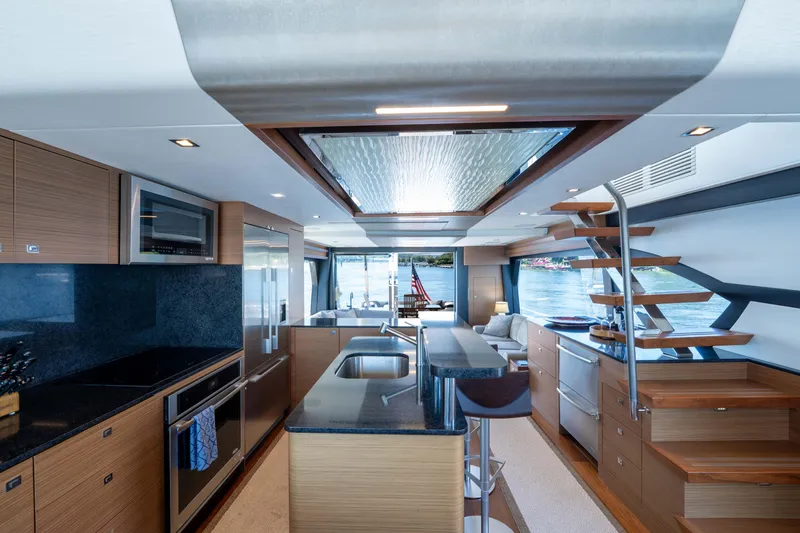 Slide: The Image of Luxurious interior of 2017 Ocean Alexander 70 E yacht with modern kitchen and scenic views. - 16