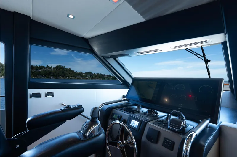 Slide: The Image of Luxurious helm of 2017 Ocean Alexander 70 E yacht with modern navigation equipment. - 19