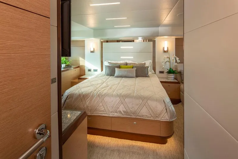 Slide: The Image of Luxurious bedroom interior of 2017 Ocean Alexander 70 E yacht, featuring elegant decor and lighting. - 22
