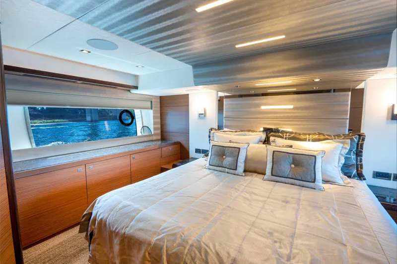 Slide: The Image of Luxurious bedroom interior of 2017 Ocean Alexander 70 E yacht with elegant bedding and scenic window view. - 24