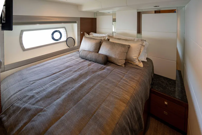 Slide: The Image of Luxurious bedroom interior of 2017 Ocean Alexander 70 E yacht with elegant bedding and window view. - 33