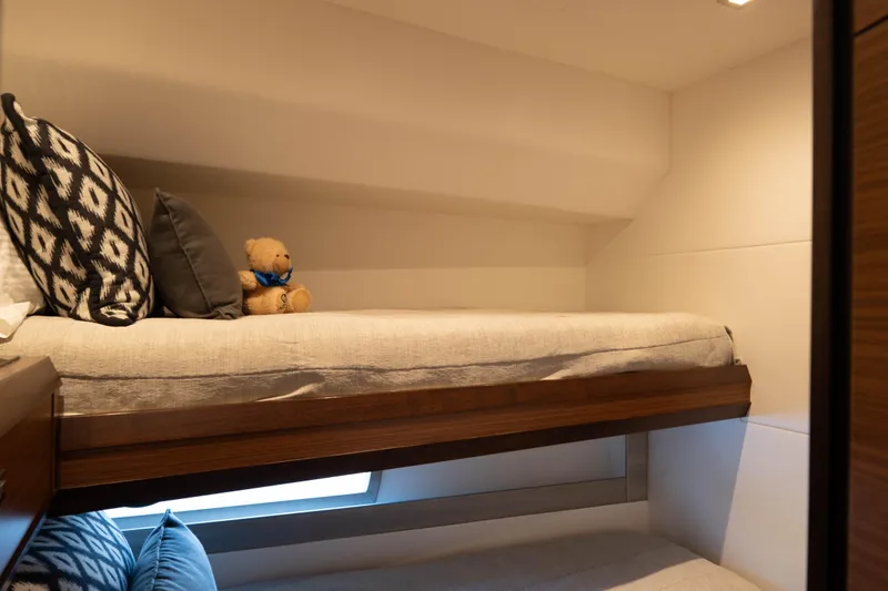 Slide: The Image of Bunk bed with pillows and teddy bear in 2017 Ocean Alexander 70 E yacht cabin. - 34