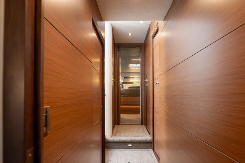 Slide: The Image of Hallway inside 2017 Ocean Alexander 70 E yacht, featuring sleek wooden paneling. - 35