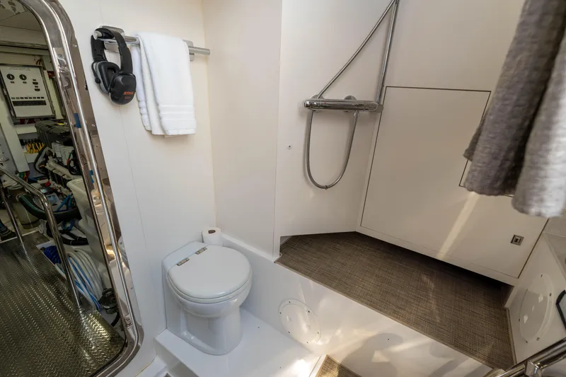 Slide: The Image of Bathroom in 2017 Ocean Alexander 70 E yacht, featuring shower and toilet. - 49