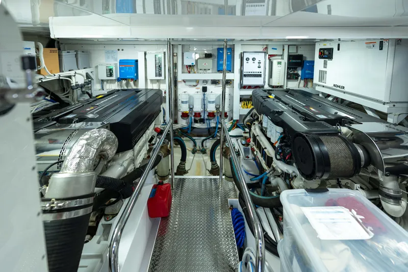 Slide: The Image of Engine room of 2017 Ocean Alexander 70 E yacht, featuring dual engines and advanced equipment. - 51