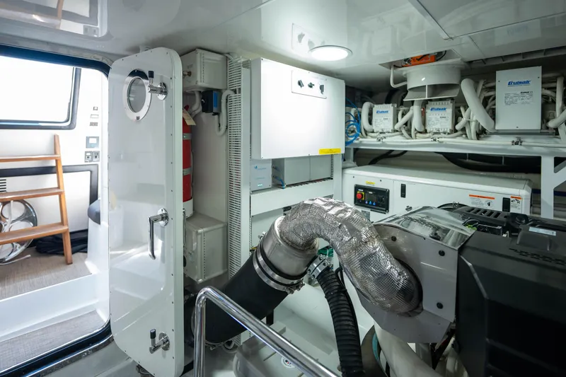 Slide: The Image of Engine room of 2017 Ocean Alexander 70 E yacht, featuring advanced equipment and systems. - 53