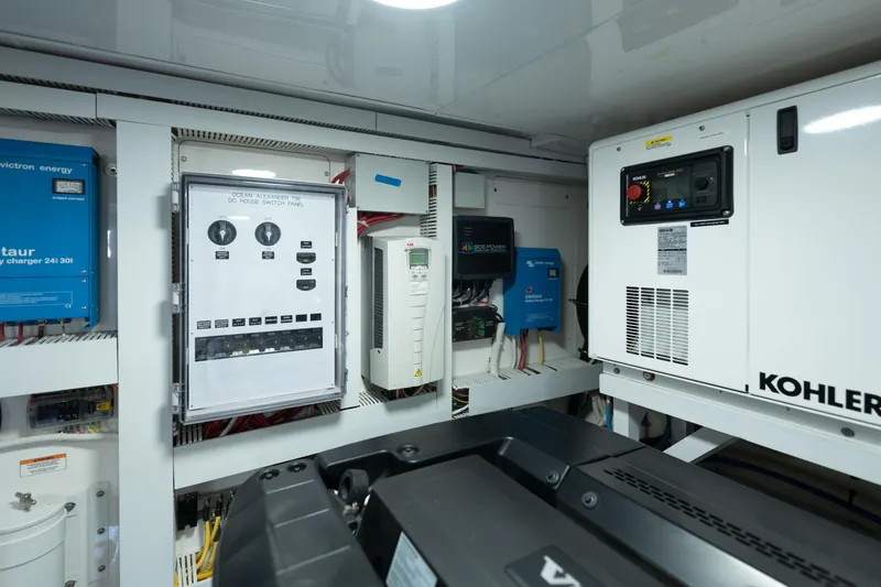 Slide: The Image of Engine room of 2017 Ocean Alexander 70 E yacht with electrical panels and Kohler generator. - 55