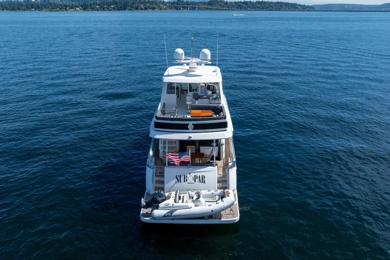 Slide: The Image of Luxury 2017 Ocean Alexander 70 E yacht on open water, rear view. - 9