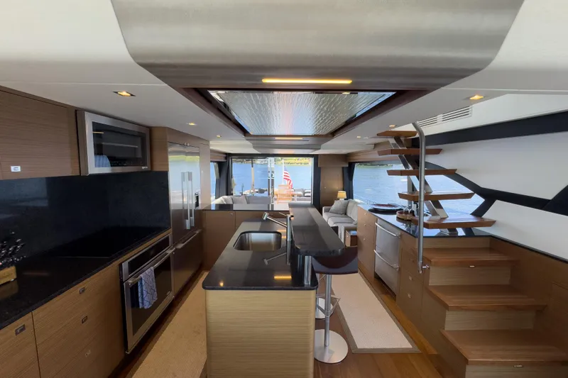 Slide: The Image of Luxurious interior of 2017 Ocean Alexander 70 E yacht with modern kitchen and scenic views. - 17