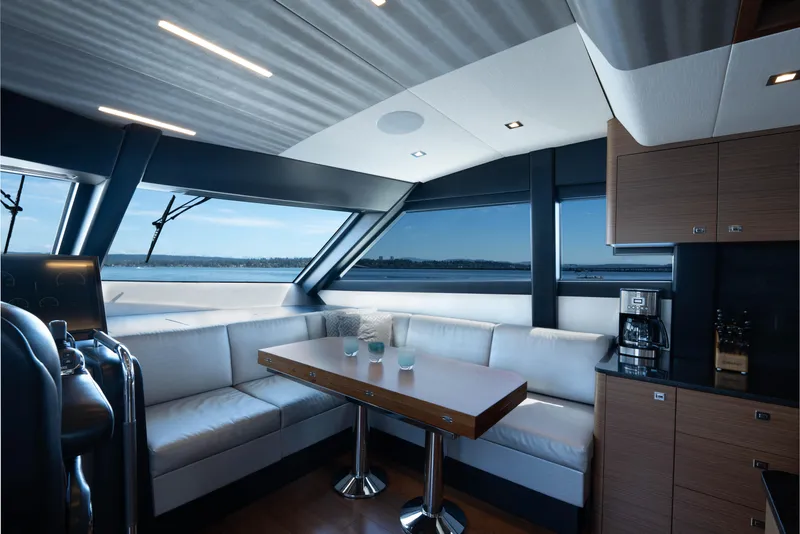 Slide: The Image of Luxurious interior of 2017 Ocean Alexander 70 E yacht with modern kitchen and seating area. - 18