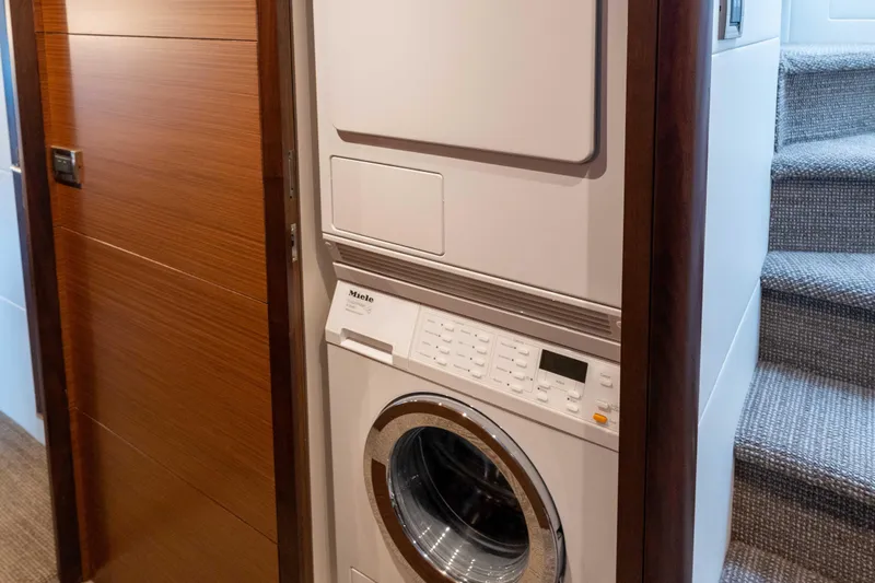 Slide: The Image of Hallway inside 2017 Ocean Alexander 70 E yacht, featuring sleek wooden paneling. - 36