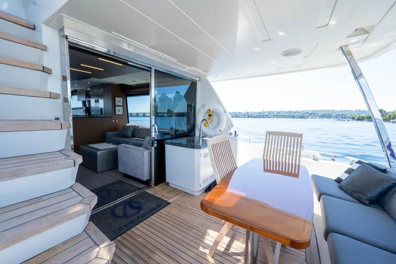 Slide: The Image of Staircase on 2017 Ocean Alexander 70 E yacht with ocean view. - 46