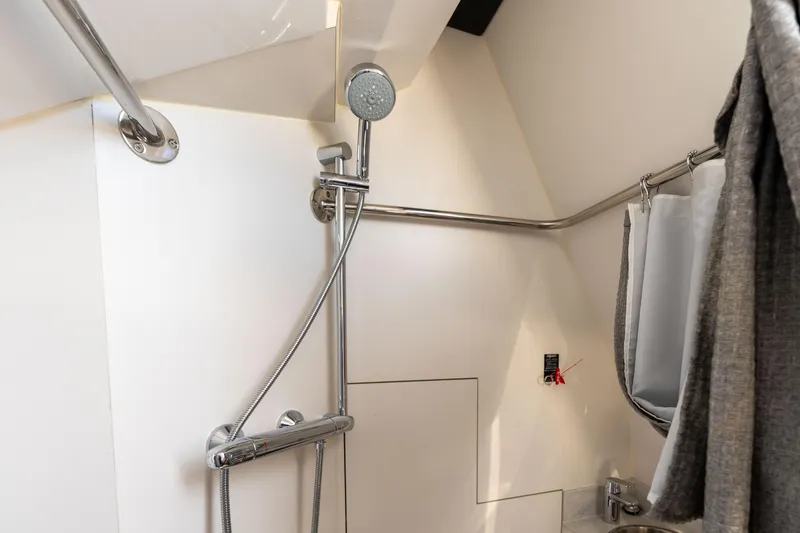 Slide: The Image of Bathroom in 2017 Ocean Alexander 70 E yacht, featuring shower and toilet. - 50