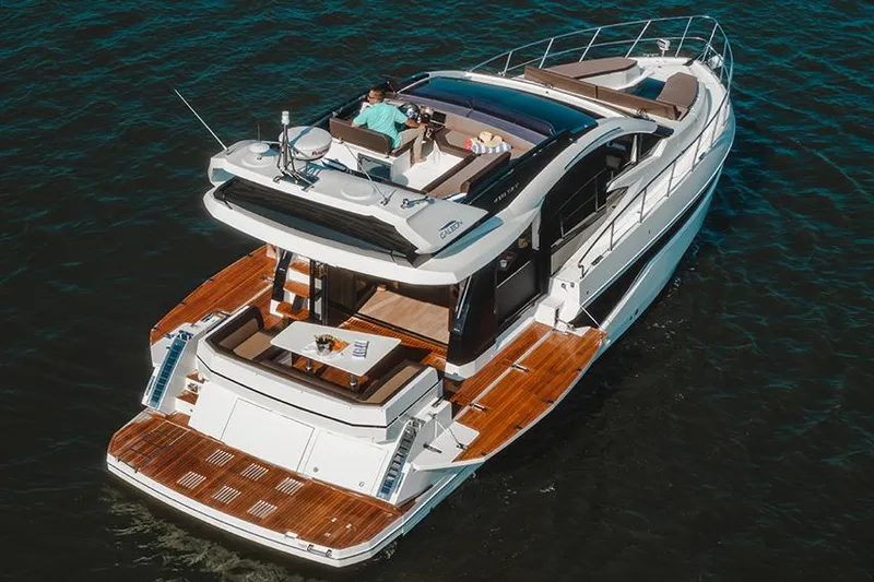 Slide: The Image of 2024 Galeon 470 Sky yacht docked at marina, showcasing sleek design and modern features. - 1
