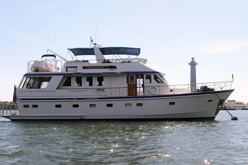 The Image of 1986 Lowland 64 Pilot House Long Range Motor Yacht on calm waters. - 0