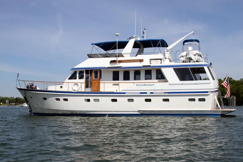 Slide: The Image of 1986 Lowland 64 Pilot House Long Range Motor Yacht on water. - 1