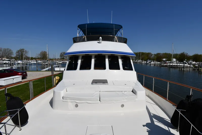 Slide: The Image of 1986 Lowland 64 Pilot House Long Range Motor Yacht docked at a marina. - 12