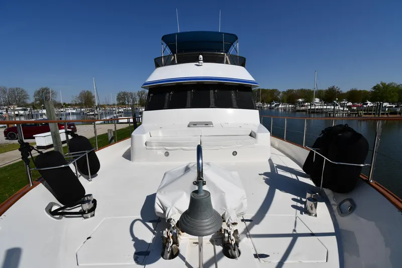 Slide: The Image of 1986 Lowland 64 Pilot House Long Range Motor Yacht docked at a marina. - 13