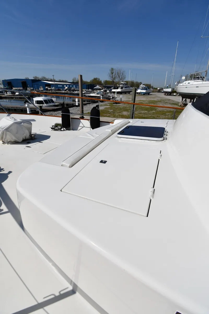 Slide: The Image of 1986 Lowland 64 Pilot House Long Range Motor Yacht deck view at marina. - 16