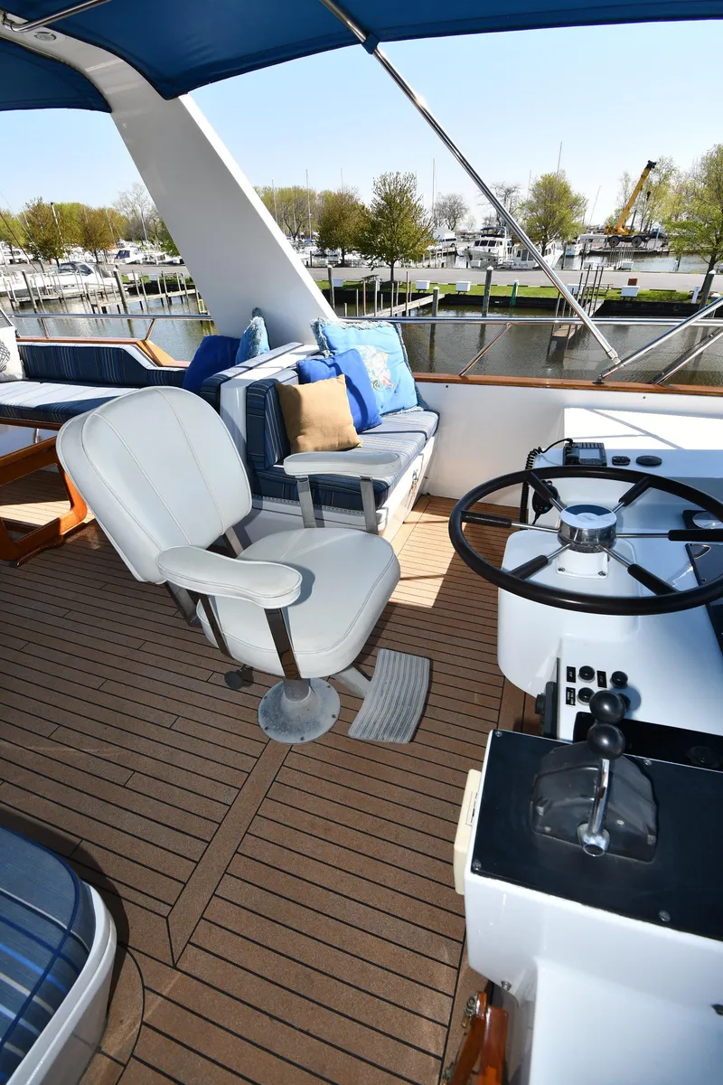 Slide: The Image of 1986 Lowland 64 Pilot House Long Range Motor Yacht helm station with seating. - 36