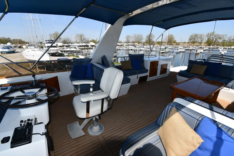 Slide: The Image of Interior of 1986 Lowland 64 Pilot House Long Range Motor Yacht with seating and helm. - 45