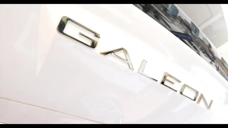 Slide: The Image of Close-up of 2024 Galeon 470 Sky yacht logo on white surface. - 13