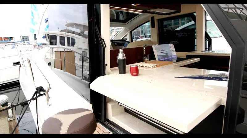 Slide: The Image of Interior view of 2024 Galeon 470 Sky yacht with modern dining area. - 15